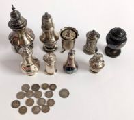 A collection of silver salt and pepper pots, total weight approx.11oz, with a box of coins
