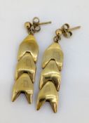A pair of 9ct gold drop earrings, each of three semi-articulated 'arrow' style links, hallmarked