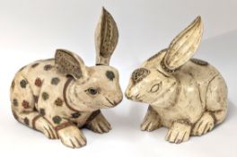 A pair of decorative rabbit sculptures, with adjustable ear