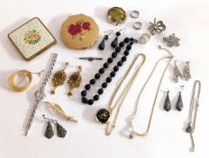 A mixed collection of costume jewellery and some silver jewellery, including brooches, beads,