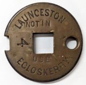 A Tyer's No6 brass single line tablet LAUNCESTON - EGLOSKERRY, stamped 'Not in Use'.