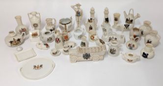 A collection various crested china, including a Carlton charabanc and boy scout figure.