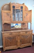 A two-part French oak dresser in Arts and Crafts style, bearing the 'Unis France' mark, height
