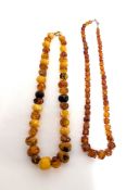 A graduated multicoloured amber bead necklace, length approx. 59cm, with a faceted amber bead