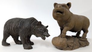 A black forest style carved wood bear figurine, length approx. 18cm, accompanied with a boar