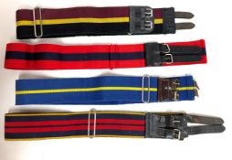 An assortment of ten military belts.