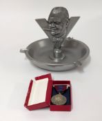 A Winston Churchill pewter ash tray, together with 1953 coronation medal (2).