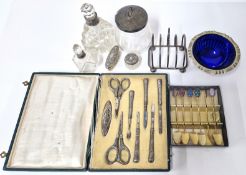 A collection of silver and silver plate mounted items, to include a cased manicure set marked '800',