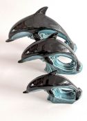 A set of three Poole dolphins.