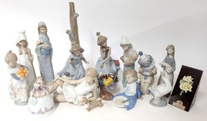 Lladro, a collection of figurines, to include a lady bell, sausage dog, girl carrying oranges,