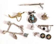 A small mixed collection of items to include a silver charm bracelet set with three charms, a