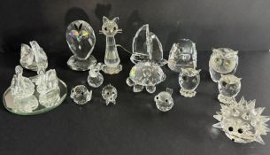 Swarovski Crystal Glass, a collection to include Owls, Cat, Tortoise etc also some stands,