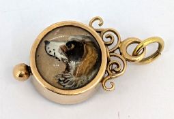 An antique double sided dog portrait & compass charm, the circular charm with a an Essex crystal