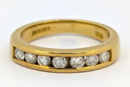 An 18ct gold seven stone diamond ring, of half eternity style, hallmarked, size J1/2, 4.7g.