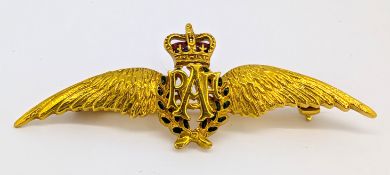 A 9ct gold and enamel RAF brooch, red and green enamelling, hallmarked, length approx. 5.3cm, 5.7g,
