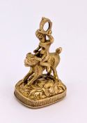 A 9ct gold bloodstone fob, the mount depicting a boy sat atop a dog, hallmarked, length approx.