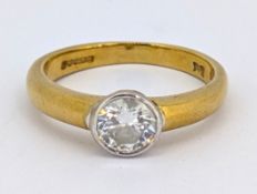 An 18ct gold diamond rubover ring, collet set with a brilliant-cut diamond, approx. 0.50 carat,