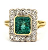 An 18ct gold emerald and diamond cluster ring, of rectangular form, collet set with an emerald-cut