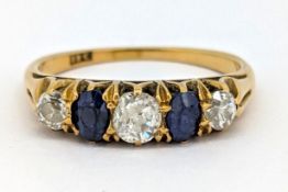 A diamond and sapphire five stone ring, claw set with three old-cut diamonds, each interspaced