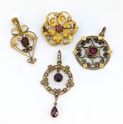 A group of three Edwardian gem-set pendants & a brooch, each of varied openwork design, two pendants