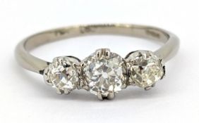 An 18ct gold & platinum three stone diamond ring, claw set with three old-cut diamonds, approx. 0.80