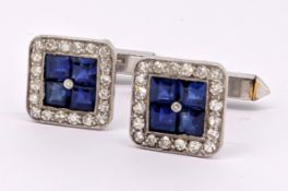 A pair of sapphire and diamond cufflinks, each set to the centre with four square-cut sapphires,
