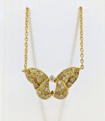 An 18ct gold and diamond butterfly necklace, curb chain to the butterfly set with an array of