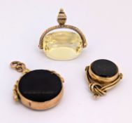 A group of three antique swivel fobs, including a 9ct gold double sided fob set with two circular