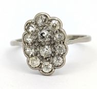 An Edwardian diamond cluster ring, grain set with old-cut diamonds, approx. 0.48 carat total,
