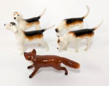 Beswick foxhound dogs and a fox.
