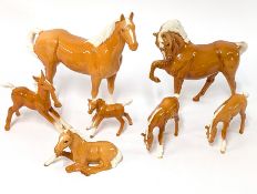 A collection of Beswick Palomino horses (7).
