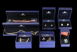 Swarovski Selection to include:- Pink/Rose Bracelet (855717), Crystal Droplets Earrings (835000),