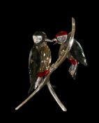 Swarovski Crystal Paradise Woodpecker figure designed by Elisabeth Adamer, featuring a pair of