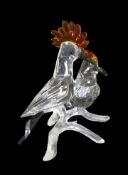 Swarovski Crystal Hoopoes birds with black tail feathers, red crests on a frosted branch, by Elisa