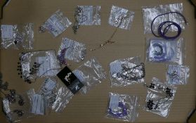 Swarovski selection to include:- Three Wheel Purple designed dark silver tone Necklace with matching