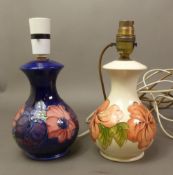 Two Moorcroft table lamps, Hibiscus on cream and Anemone on blue, height to top of ceramic 17cm (