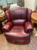 Ox blood red leather armchair.
