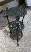 Cast metal three tier pan/plant stand, height 66cm.