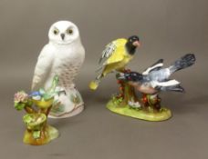 Three Crown Staffordshire bird figures/figural groups, including a Snowy Owl, Blue Tit and larger