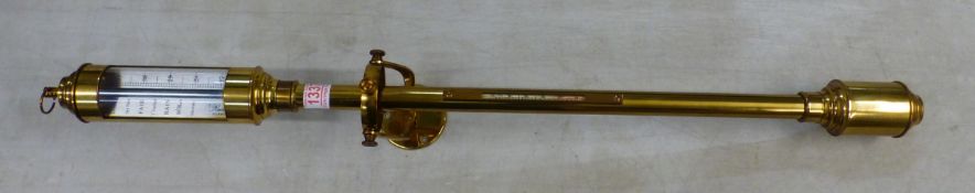 A nautical stick barometer by Russell of Norwich, 92cm in length, with brass gimbal wall mount.