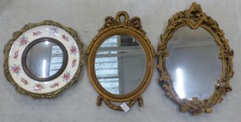Three vintage wall mirrors, two have ornate gilt frames, the third has a brass frame with a Burleigh