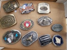 A collection of 11 belt buckles, including Pepsi Cola and Southern Comfort examples (11).