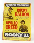 Medium size tin 'Rocky II' advertising sign. (H: 40cm x L: 30cm)