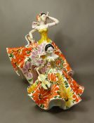Two large polychrome Italian dancing figures, height of tallest 40cm (2).