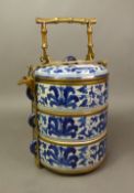 Chinese blue and white three tiered tiffin carrier, 6 character marks to base, overall height 29.