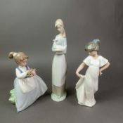 Three Nao figurines, Girl with Goose, Girl with Flowers and a Girl in a Long Dress, height of
