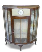 A mid century walnut D-shaped glazed China display cabinet with a built-in Smiths 30 hour clock,