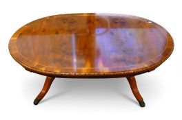 Oval Yew wood Regency style inlaid coffee table with lions paw feet, H48cm x W125cm x D78cm. COURIER