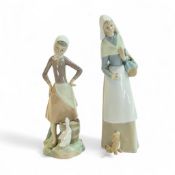 Lladro figurines 'Shepherdess with Dog' (1034), together with a girl with a pail of milk and