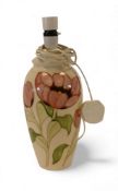 Moorcroft table lamp in the Pink Magnolia pattern on cream ground (H: 35cm)